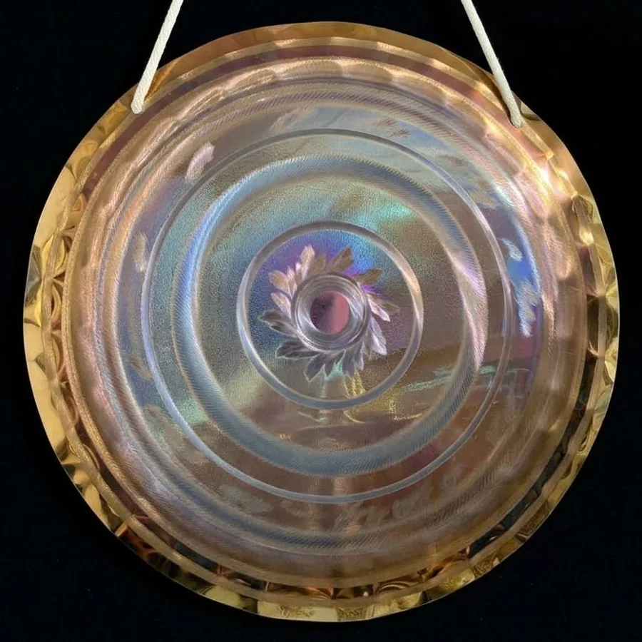 Pale gold 50 cm handheld gong with a small engraved flower at its centre