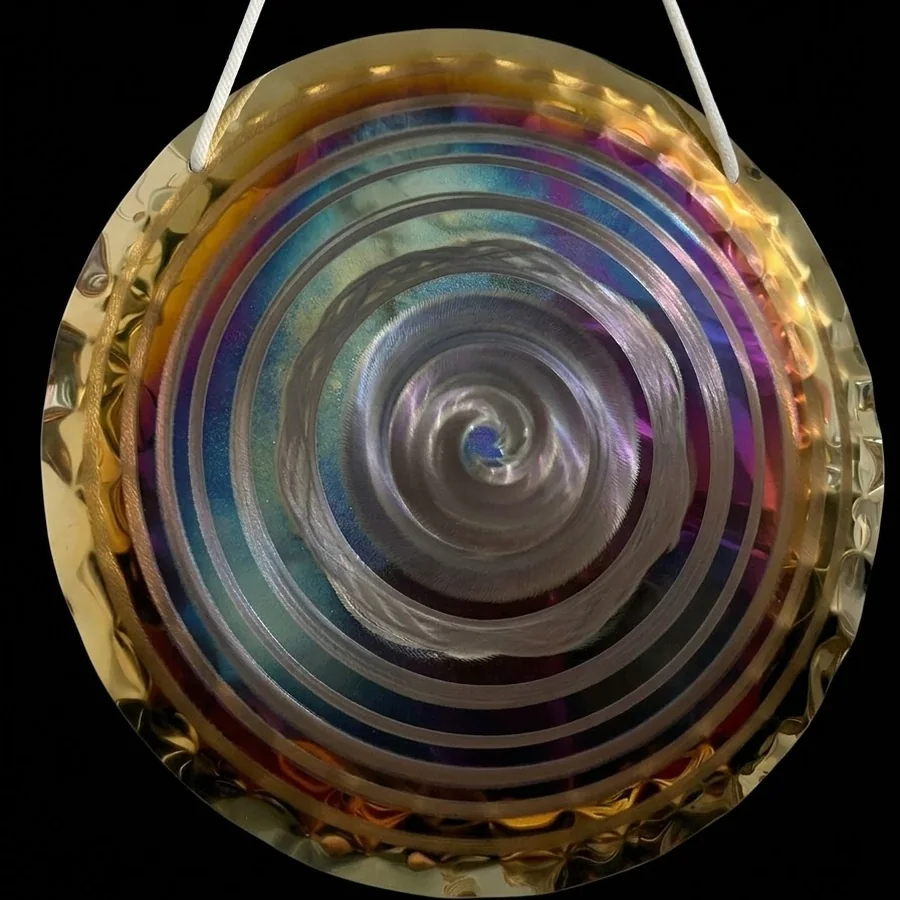 The same violet and blue 50 cm gong seen from a slightly different angle, showing the light across its rings